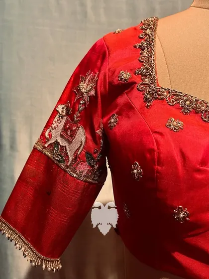 The sleeve of the Pichwai blouse, showing the intricate details.