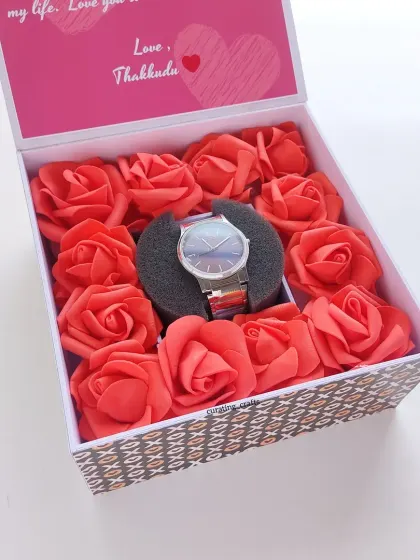For a classic and romantic gift, I created this watch box. The watch is nestled in a bed of soft foam roses, with a personalized message printed on the inside of the lid.