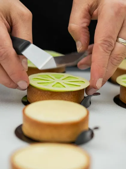 Another angle of Chef Antonio Bachour's precise decoration work on his signature tarts.