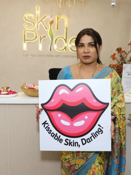 "Kissable Skin, Darling!" A client holds one of our fun signs, capturing the playful and confident spirit of our clinic.