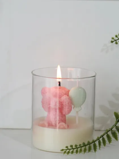 Announcing a new arrival is a joyous occasion. We created this adorable teddy bear candle as a unique birth announcement favor, a sweet and memorable way to share your happy news.