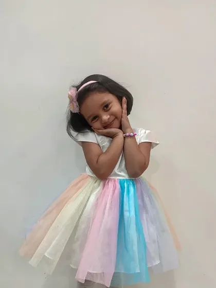A rainbow of pastel colors in one magical dress. The layered tulle skirt creates a beautiful multi-color effect that is perfect for a unicorn or rainbow-themed party.