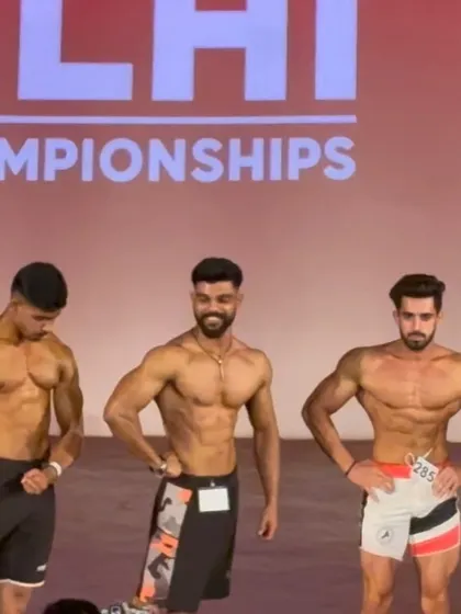 On stage with fellow competitors. The level of competition in men's physique is always high.