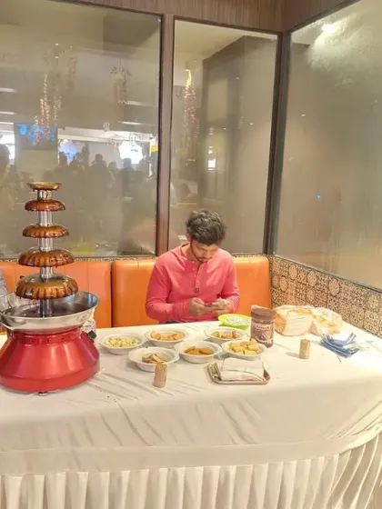 A chocolate fountain station we arranged for a birthday party. It comes with a variety of dips like fruits, marshmallows, and wafers, and is a delicious treat for all guests.