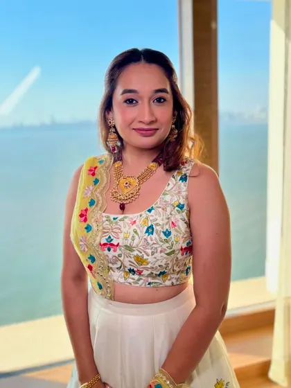 Sheer glow and radiance for this bridesmaid. The makeup is minimal and dewy, perfect for a daytime wedding.