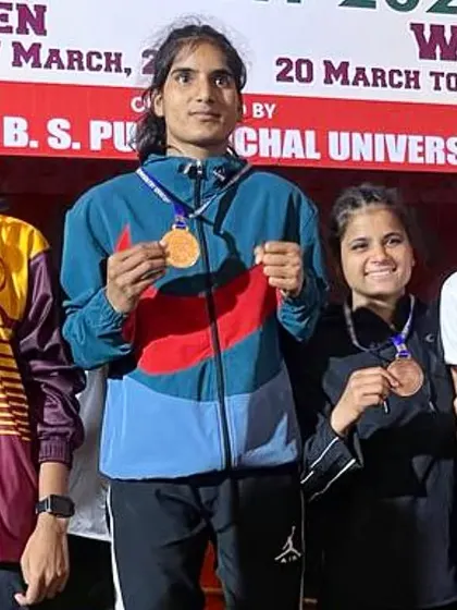Our fighter, Preeti Yadav, on the podium after winning a bronze medal at the All India Inter-University tournament.