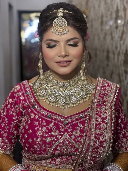 Another angle of this beautiful bride, showing the soft glam eye makeup and the perfect pairing with her statement kundan necklace. The skin is kept fresh to let her natural beauty shine through.