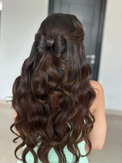 A back view of the hair bow style, showing how the bow is crafted from the hair itself for a seamless look.