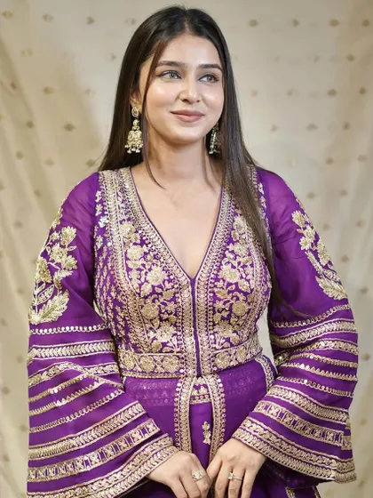 A closer look at the stunning gold embroidery on this regal purple Anarkali.