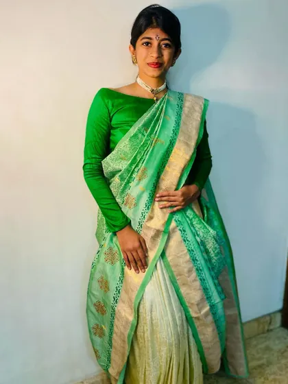 A contemporary way to revamp an old Kanjeevaram. We used block printing to add a new design to this beautiful green and cream saree, worn here with a modern full-sleeve blouse.