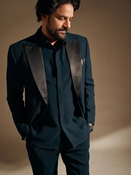 A close-up that highlights the texture of the fabric and the sharp cut of the satin lapel. It’s all in the details.