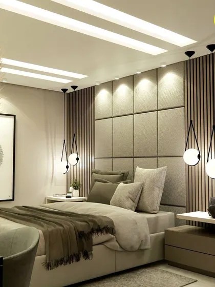 A close-up of the bed and headboard, with its combination of upholstered panels, wood fluting, and unique teardrop-shaped pendant lights.
