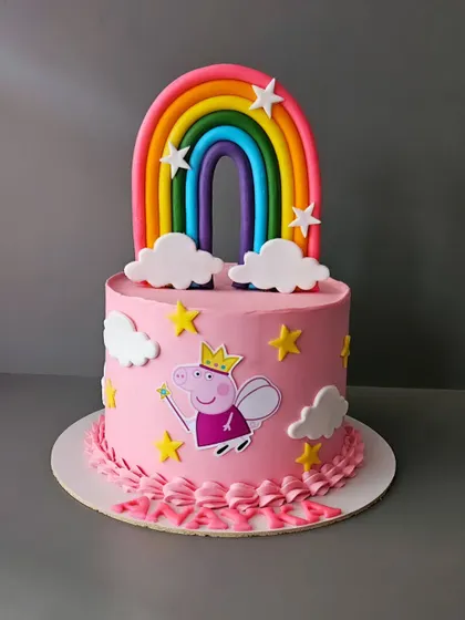 Peppa Pig again! This pink cake for Anaya features Peppa as a fairy princess, complete with a rainbow, stars, and clouds. A magical cake for a little fan.