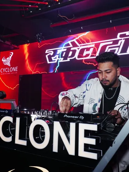 At the decks at Cyclone, with my name displayed in Hindi on the LED screen behind me.