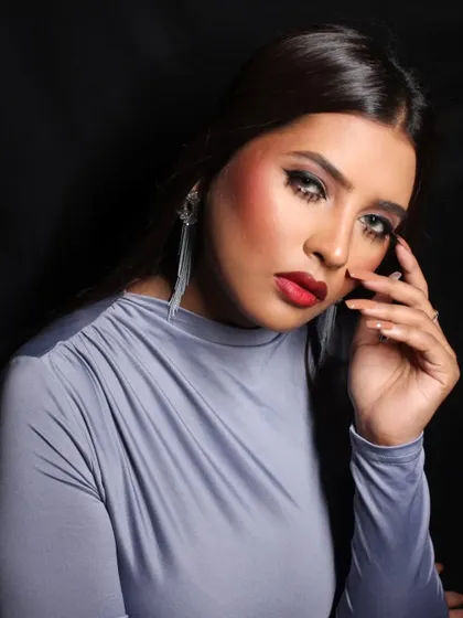 A confident and engaging pose, perfect for a model's headshot.