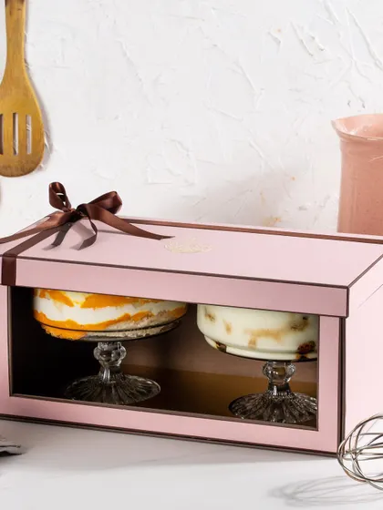 Our twin trifle gift box in pink, designed to hold two of our glass dessert cups side-by-side. It's perfect for gifting a pair of complementary flavours like Mango Cream Cheese and Tiramisu.