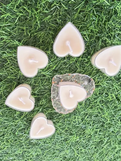 A set of heart-shaped tea light candles, perfect for Valentine's Day or as a romantic gift.