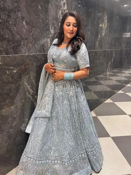 A full-length view of this stunning powder blue rental lehenga, showing how it creates a graceful and cohesive silhouette.