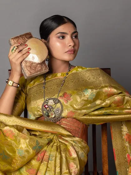 I provided creative styling and art direction for this Zari Jaipur shoot, featuring a stunning handloom Banarasi saree. I paired it with a statement tribal necklace and an embroidered bag to create a rich, artistic, and traditional look.