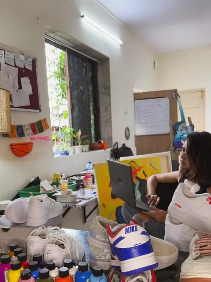 Here I am in my creative space, surrounded by paints, brushes, and a few works-in-progress. This is where I check emails and work on digital mockups for new projects.