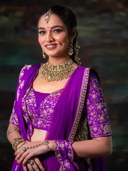The model's confident smile shows how a bold makeup choice can enhance your entire look.