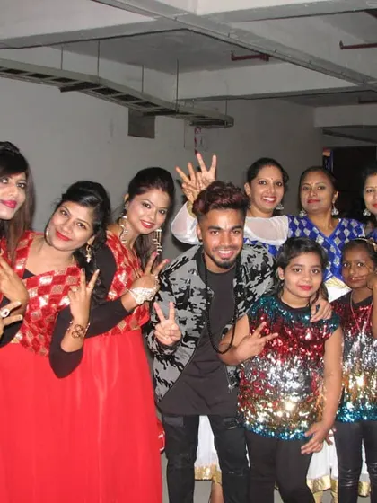 A big group photo with my students at a Rathayatra event. I work with mixed groups of adults and children to create inclusive performances for community celebrations.