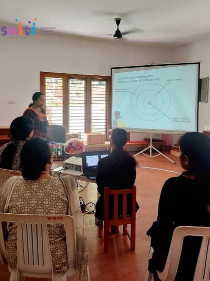 A focused shot of the workshop at Smiti Montessori, highlighting the importance of understanding child development for creating an effective learning environment.