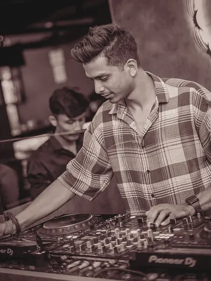 In my element at Toca Koramangala. This sepia-toned shot captures me deep in concentration, crafting the perfect sound for the room.