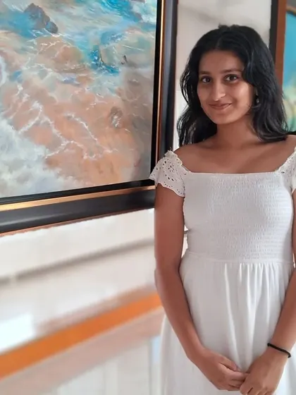 A young visitor enjoying the calming artworks at the 'Serenity' exhibition.