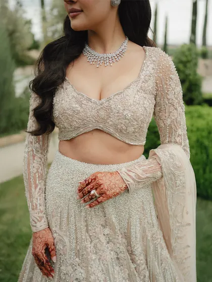 A color version of the previous shot, showing the delicate beadwork on Nita's Gaurav Gupta blouse and her beautiful henna.