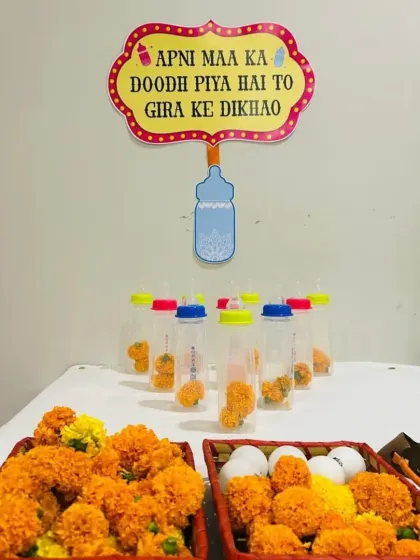We believe every celebration needs a dose of fun. This quirky baby bottle bowling game, complete with a cheeky 'Apni Maa ka Doodh Piya Hai' sign, is just one example of how we add playful and memorable games to the party.