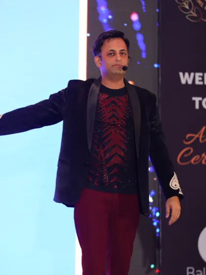 My stage presence is all about connecting with the audience. Here, I'm engaging with the crowd at the Balrampur Chini Mills event, making sure everyone feels involved.