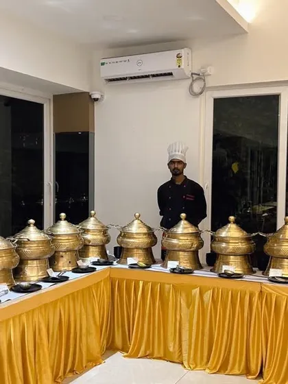 A special buffet setup with traditional brass serving dishes for a Magh Bihu celebration, showing our ability to cater to cultural events.