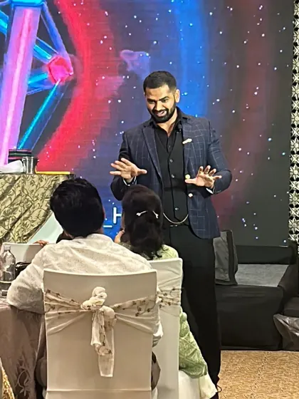 Performing table-side magic for guests at a private event. I move from table to table, ensuring everyone gets a front-row seat to their own personal magic show.
