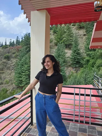 Feeling like a happy puppy on the balcony of our farm stay. The fresh mountain air and the stunning views of the pine-covered hills just fill my heart with joy.
