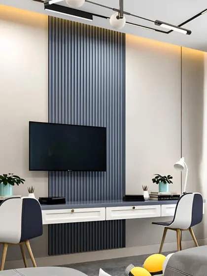 This design doubles as a study area, showing how versatile modular furniture can be. The TV is centered on a fluted blue panel, with a floating desk and shelving on either side, making it a perfect setup for a studio apartment or bedroom.