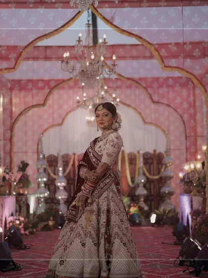 Radiant and stunning, our bride is pure magic inside the royal mandap we designed for her special day.