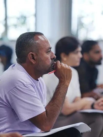 A student contemplates a complex topic during our lecture on contraindications and safety protocols. We encourage thoughtful questions to ensure complete understanding.