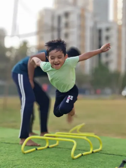 The pure joy of movement. This young athlete is flying over the hurdles, building athleticism and having a great time.