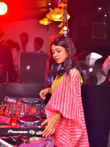 At the console during the Navratri party, mixing festive tracks. My goal is to create an authentic and exciting musical experience.