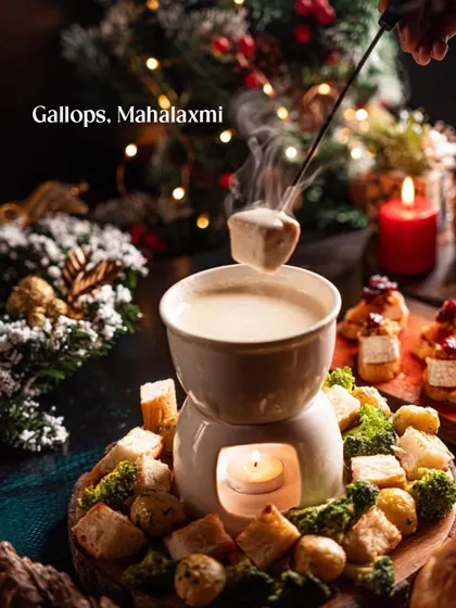 A steaming cheese fondue at Gallops, Mahalaxmi. This image evokes a sense of warmth and communal celebration, perfect for a Christmas dining guide.