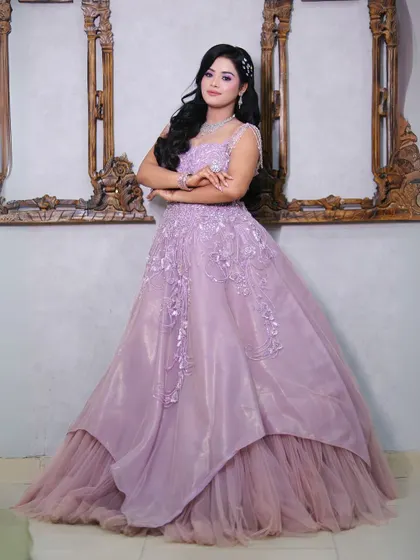 A full-length pose in the lavender princess gown, highlighting its elegant silhouette and dreamy feel.