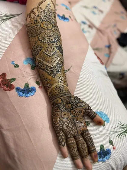 This is a detailed view of my intricate bridal henna work. Each design is unique, combining traditional patterns like paisleys and mandalas with fine-line fillers to create a stunning, full-coverage look for your special day.