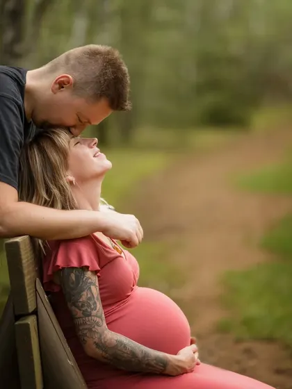 The pure happiness on her face says it all. This photo captures the joy and anticipation of motherhood in a natural, outdoor setting.