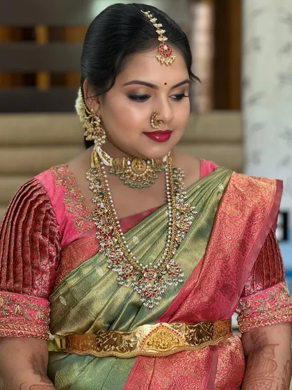 This image showcases a beautiful balance between the soft green and pink saree and the bold makeup. You'll learn color theory to make these kinds of perfect pairings.