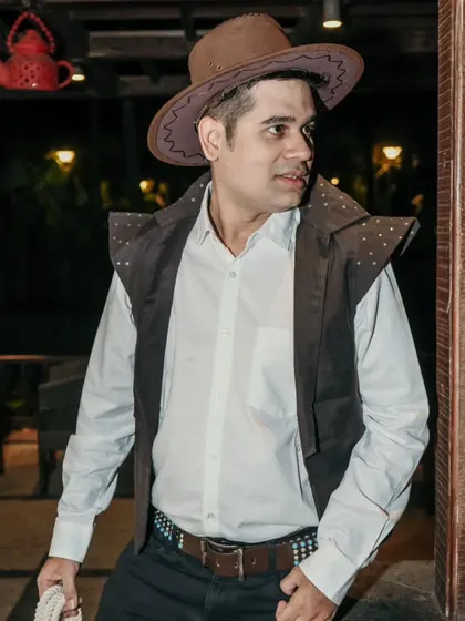 Howdy, partner! Dressed up as a cowboy for a Western-themed event. I'm always ready to embrace the theme and add to the fun.