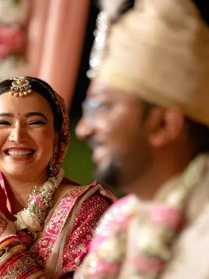 A beautiful, wide smile from the bride, capturing a moment of pure happiness during her wedding.