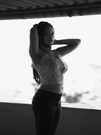 The same silhouette portrait in black and white. This version really highlights the form and shape of the subject against the bright background.