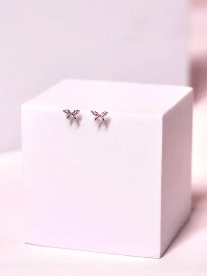 Tiny butterfly studs, perfect for a subtle touch of whimsy and elegance. These are great for second or third lobe piercings.