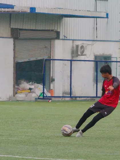 Mastering ball control is fundamental. Here, a player practices their striking technique on our professional-grade turf, focusing on power and accuracy.